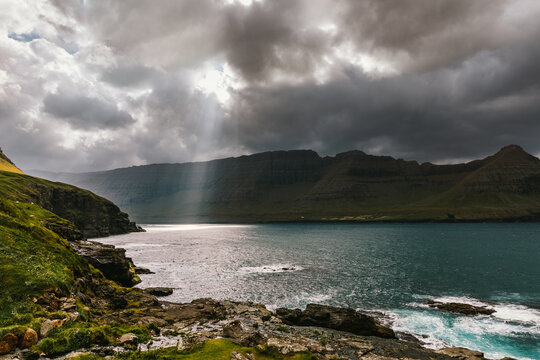 Fjord with sunbeams in the Faroe Islands