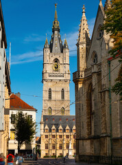 Fototapeta na wymiar Belfry of Ghent under deep blue sky. Tallest belfry in Belgium, UNESCO World Heritage Site.