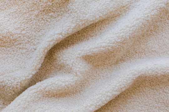 Folded faux beige fur texture