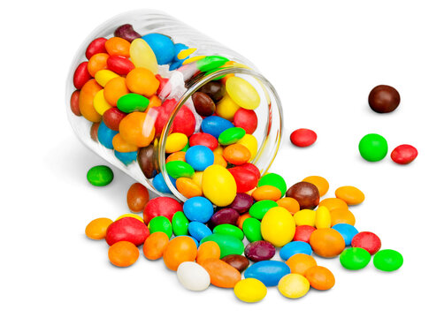 Glass jar with colorful candies on white background