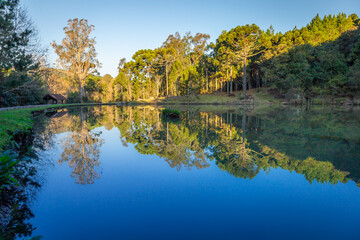 Southern Brazil countryside and lake reflection landscape at peaceful sunrise