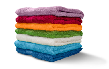 Pile of  fluffy towels on background