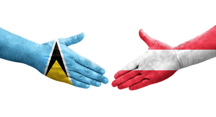 Handshake between Austria and Saint Lucia flags painted on hands, isolated transparent image.