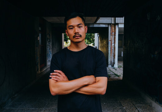 Portrait of Handsome Chinese Man With Dark Background
