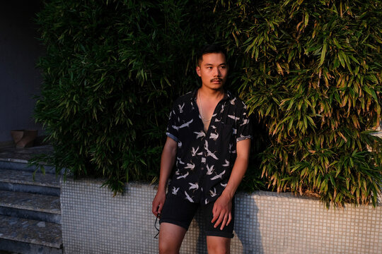 Handsome Asian Man With Tropical Background