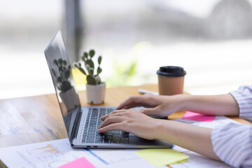 Close up of Business hands working in Stacks of paper files for searching information on work desk workplace office, Office employee working with documents achieves with clips at table in workplace.