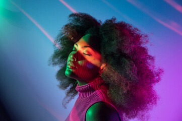 African American model under colorful neon illumination