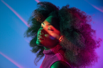 African American model under colorful neon illumination