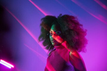 African American model under colorful neon illumination