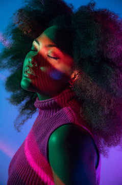 African American model under colorful neon illumination
