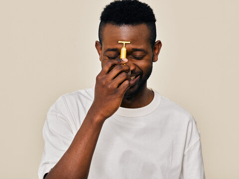 Smiling man using t-shape roller