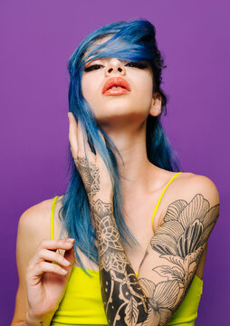 Stylish woman with closed eyes in studio