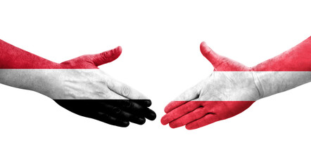 Handshake between Austria and Yemen flags painted on hands, isolated transparent image.