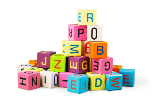 Colorful toy blocks with letters on white background