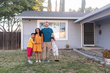 Gorgeous multiracial family portrait at home garden
