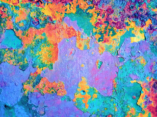 Colorful street wall facade with damaged plaster.