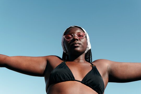 Relaxed Black woman in a bikini portrait