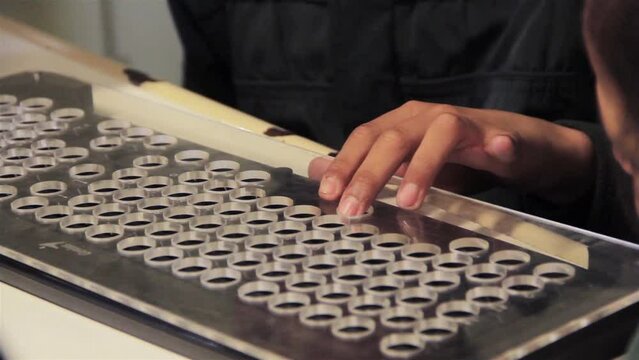 Blind School Student Touching a Computer Keyboard during a Computer Lesson in Classroom. Close Up.  