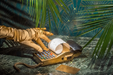 Conceptual still life about expensive purchases and a gold credit card