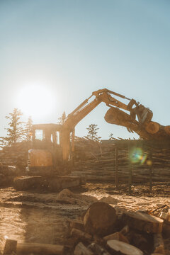 operating excavtor at sunset