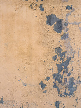 peeling multi-colored paint over concrete