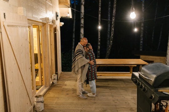 Couple Standing On The Porch