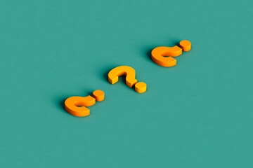 three yellow question marks