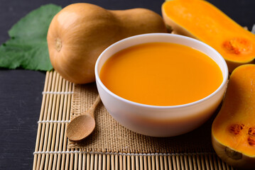 Butternut squash pumpkin soup in bowl, Homemade food in autumn season