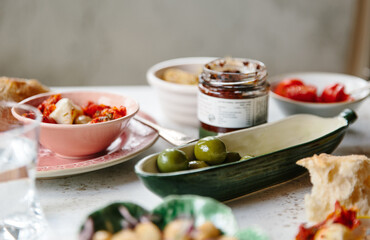 Plump green olives served as part of a meal of anti pasti.