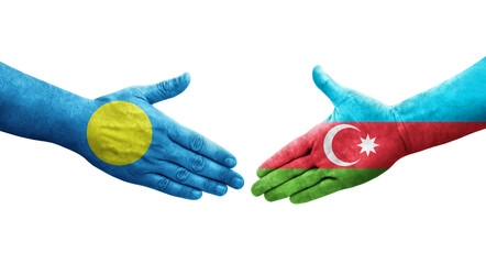 Handshake between Azerbaijan and Palau flags painted on hands, isolated transparent image.