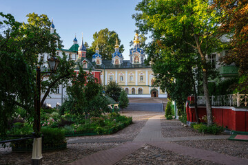 Obraz premium View of the Assumption Cathedral, the Great Belfry and the sacristy in the Holy Dormition Pskov-Pechersk Monastery on a sunny summer day, Pechory, Pskov region, Russia