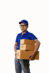 Picture of happy young man in blue hat and blue t-shirt standing with yellow boxes isolated on white background, delivery concept.