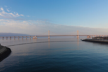 Fototapeta premium The city by the sea and the sea bridge in Dalian, China