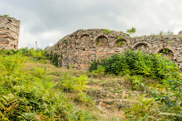 Fototapeta premium Interior stone and brick wall of castle ruins