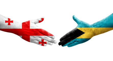 Handshake between Bahamas and Georgia flags painted on hands, isolated transparent image.