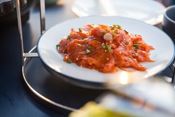 Thai style traditional cuisine raw pork or chicken marinated with spices and sprinkle with white sesame