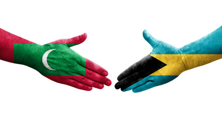 Handshake between Bahamas and Maldives flags painted on hands, isolated transparent image.