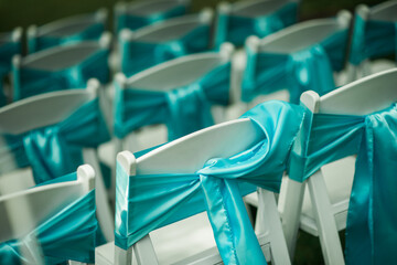 Blue ribbon out door wedding chairs