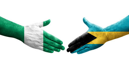 Handshake between Bahamas and Nigeria flags painted on hands, isolated transparent image.