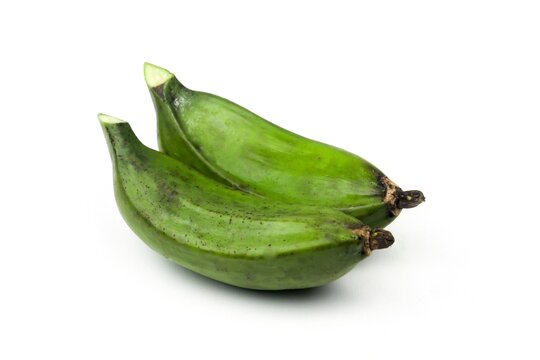 two green bananas on a white background