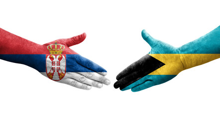 Handshake between Bahamas and Serbia flags painted on hands, isolated transparent image.