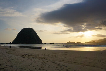 Dramatic sunset at Pulau Merah beach in Banyuwangi, East Java, Indonesia. 