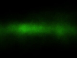 Fog and green beams horizontally in the darkness.