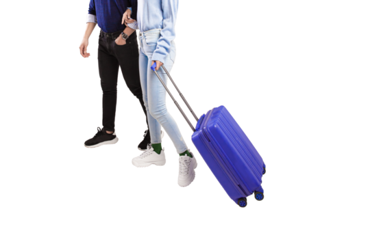 Male and female traveler holding hands happily walking with blue suitcase with transparent background