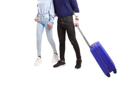 Male and female traveler holding hands happily walking with blue suitcase with transparent background