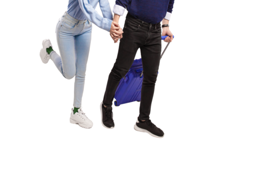 Male and female traveler holding hands happily running with blue suitcase with transparent background