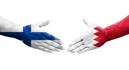 Fototapeta premium Handshake between Bahrain and Finland flags painted on hands, isolated transparent image.
