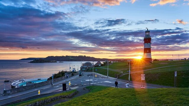 Plymouth Hoe with Smeaton's Tower lighthouse, sunset timelapse. City, Devon, England, UK