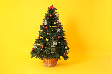Concept of Happy New Year, Christmas tree on yellow background