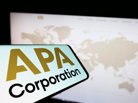 Stuttgart, Germany - 10-03-2022: Smartphone with logo of American petroleum company APA Corporation on screen in front of business website. Focus on right of phone display.